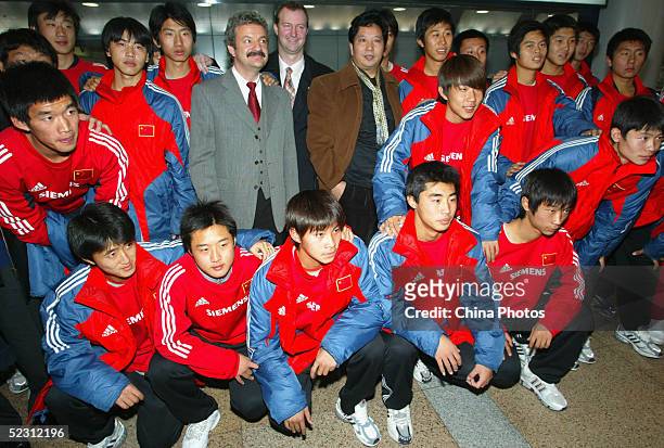Karl Heinz Laudenbach , Mayor of Bad Kissingen of Germany, stands with members of the Chinese '08 Star Team, during a ceremony to welcome their...