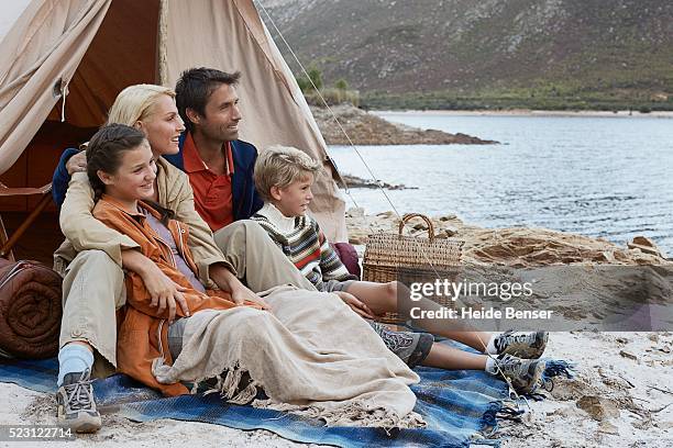 family relaxing near lake - hot wife stockfoto's en -beelden