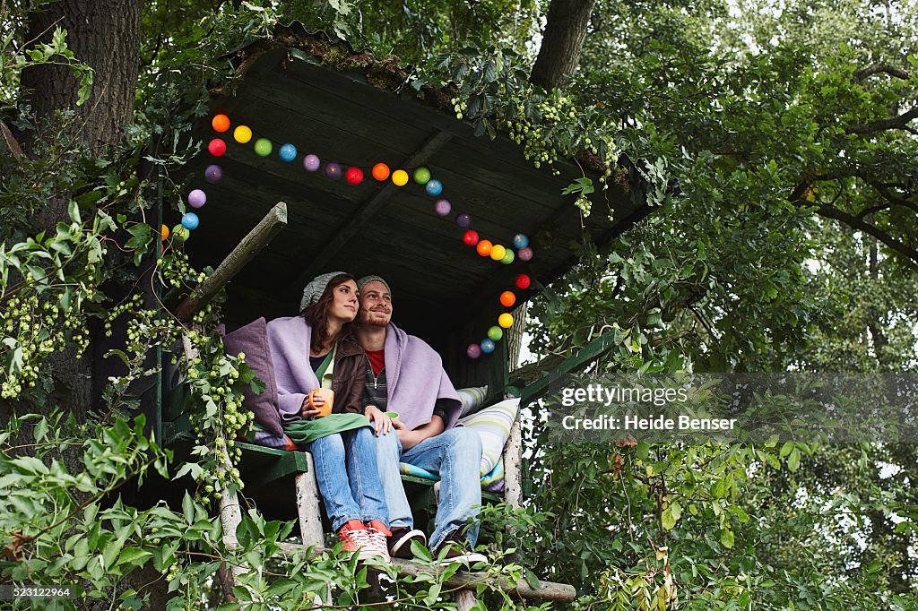 Couple Sitting in a Secluded Hut