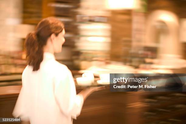 waitress with tray of coffee - blurred motion restaurant stock pictures, royalty-free photos & images