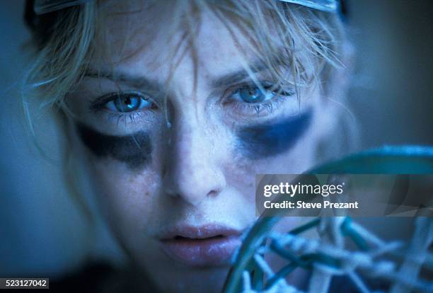 intense female lacrosse player - lacrosse stock-fotos und bilder