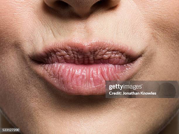 close-up of mouth - pout lips stock-fotos und bilder