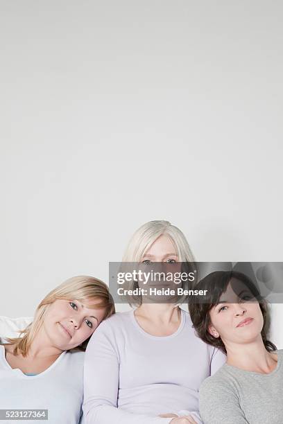 three generations of women - family formal portrait stock pictures, royalty-free photos & images