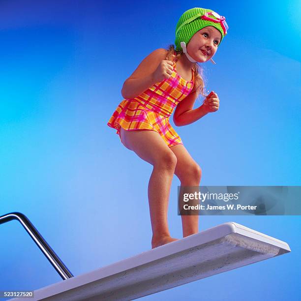 girl preparing to pool dive - sprungturm stock-fotos und bilder