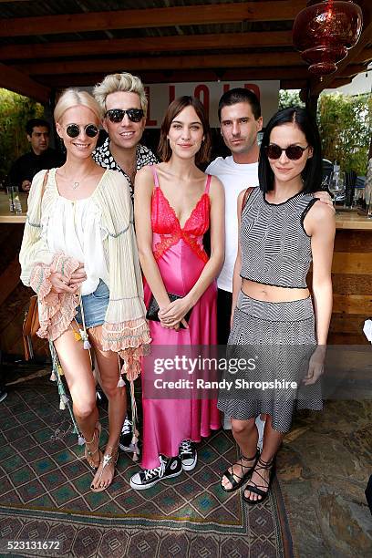 Poppy Delevingne, Nick Grimshaw, Alexa Chung, Geordon Nicol and Leigh Lezark attend the Villoid garden tea party hosted by Alexa Chung at the...