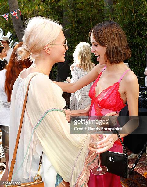 Poppy Delevingne and Alexa Chung attend the Villoid garden tea party hosted by Alexa Chung at the Hollywood Roosevelt Hotel on April 21, 2016 in...