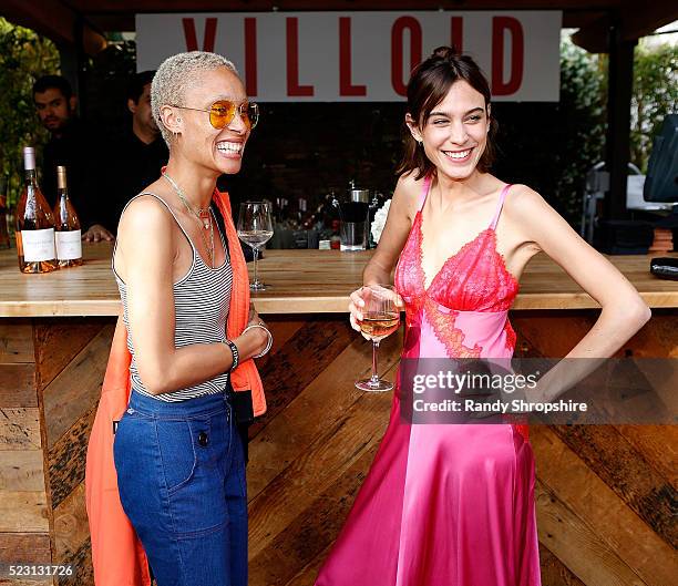 Adwoa Aboah and Alexa Chung attend the Villoid garden tea party hosted by Alexa Chung at the Hollywood Roosevelt Hotel on April 21, 2016 in...