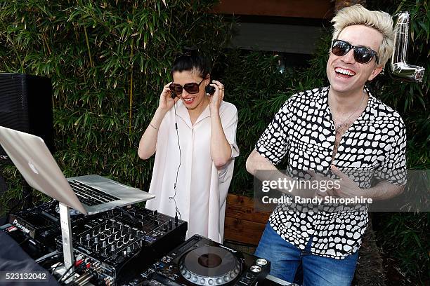 Tabitha Denholm and Nick Grimshaw attend the Villoid garden tea party hosted by Alexa Chung at the Hollywood Roosevelt Hotel on April 21, 2016 in...