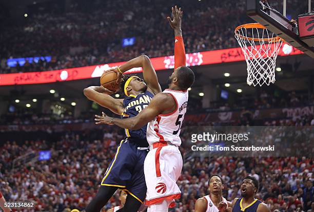 Myles Turner of the Indiana Pacers goes to the basket against Patrick Patterson of the Toronto Raptors in Game One of the Eastern Conference...