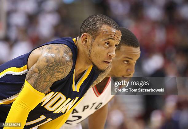 Monta Ellis of the Indiana Pacers and Norman Powell of the Toronto Raptors look on in Game One of the Eastern Conference Quarterfinals during the...