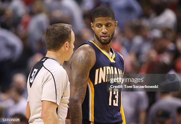 Paul George of the Indiana Pacers talks to NBA official Josh Tiven against the Toronto Raptors in Game One of the Eastern Conference Quarterfinals...