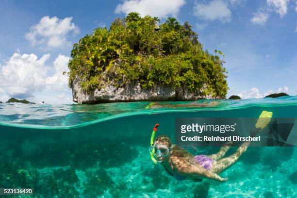 tourist snorkeling at palau, micronesia, palau - palau stockfoto's en -beelden