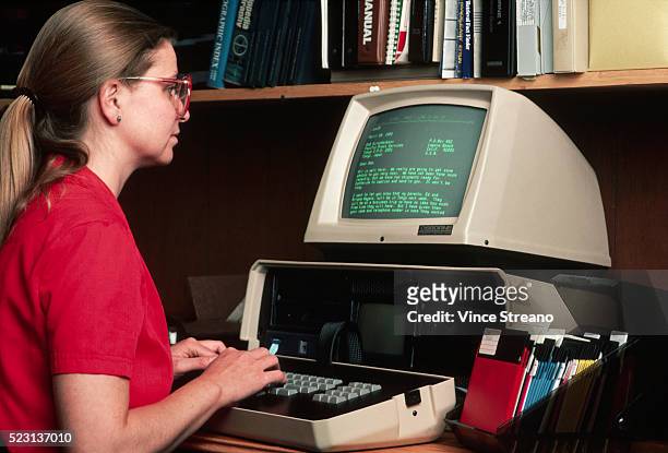 office worker using computer - vintage computer stock pictures, royalty-free photos & images