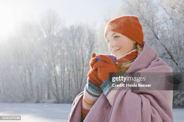 woman drinking hot beverage - 温かい飲み物 ストックフォトと画像