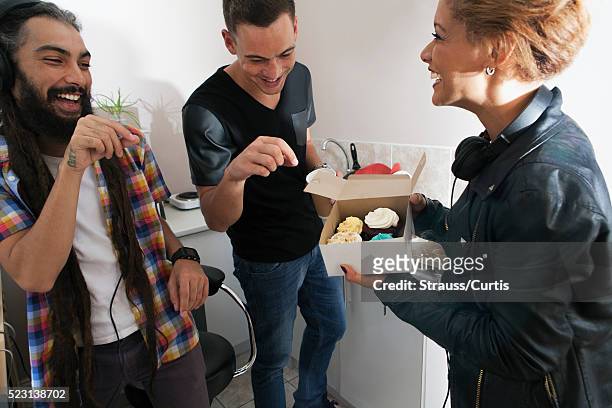 friends enjoying cupcakes and coffee - cupcake box stock pictures, royalty-free photos & images