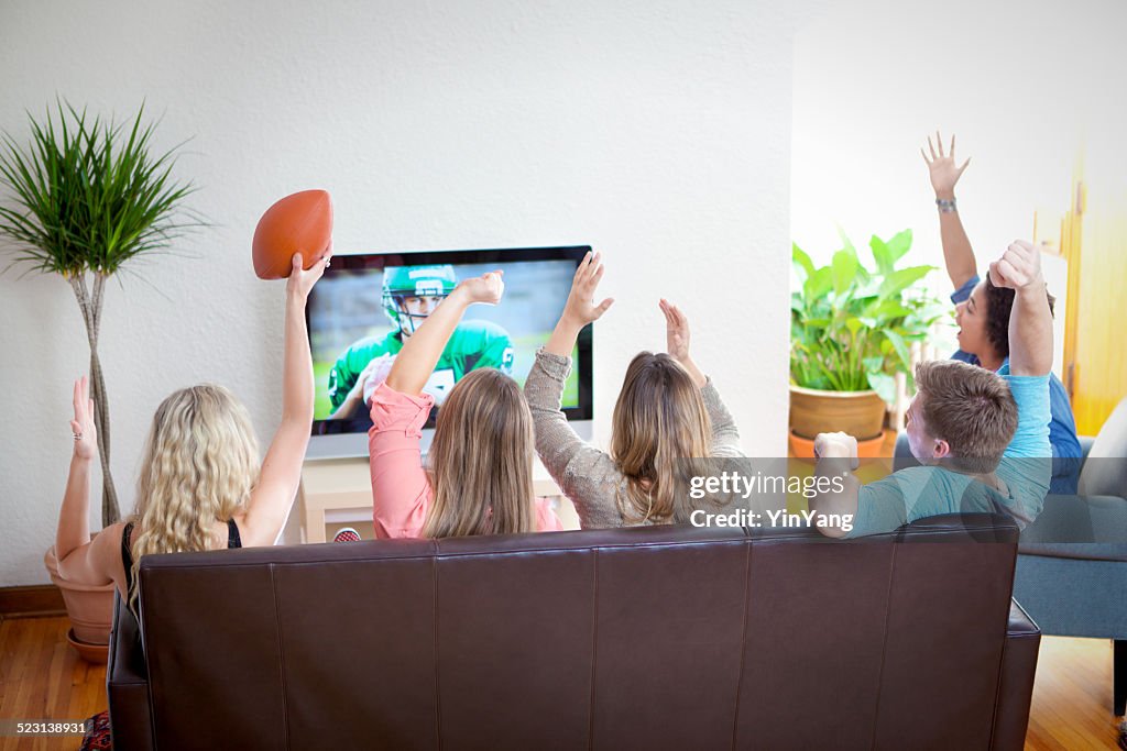 Youth Group Watching Sport Football Program on TV Together