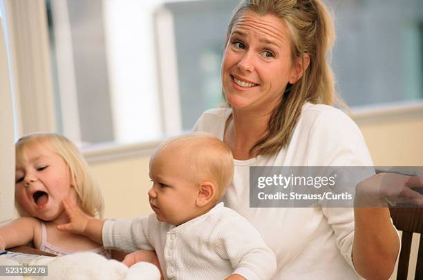 mother trying to work - sighing stock pictures, royalty-free photos & images