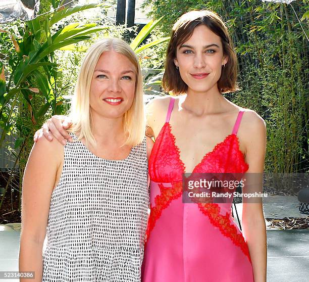Karin Kallman and Alexa Chung attend the Villoid garden tea party hosted by Alexa Chung at the Hollywood Roosevelt Hotel on April 21, 2016 in...