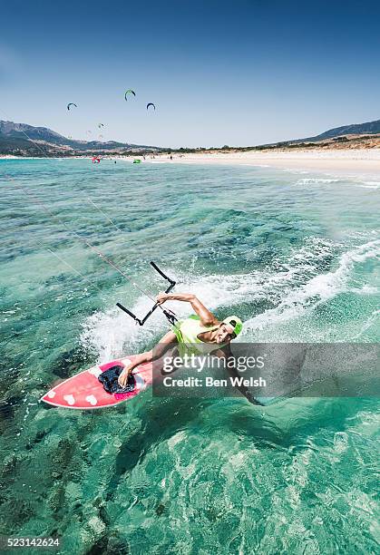 woman kitesurfing, tarifa, costa de la luz, cadiz, andalusia, spain - cadiz spain stock pictures, royalty-free photos & images