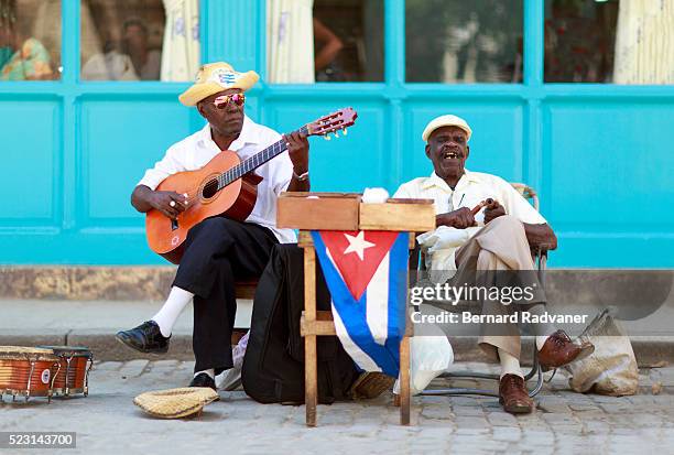 2 cuban men playing music in havana street - havana music stock pictures, royalty-free photos & images