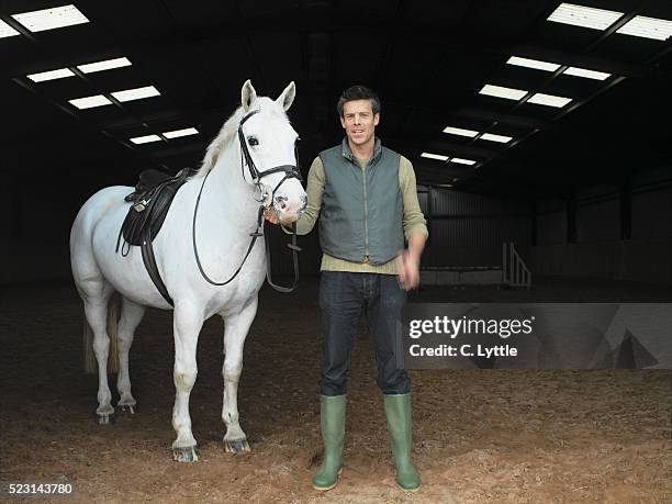 man with horse - zoowärter stock-fotos und bilder