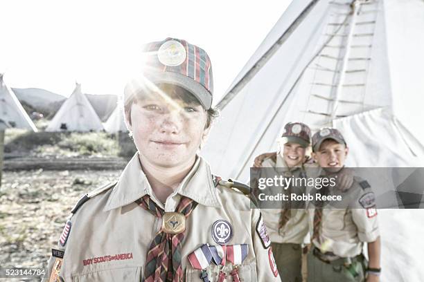 three young, weblo boy scouts standing near a teepee at a camp in colorado. - boy scout camp 個照片及圖片檔