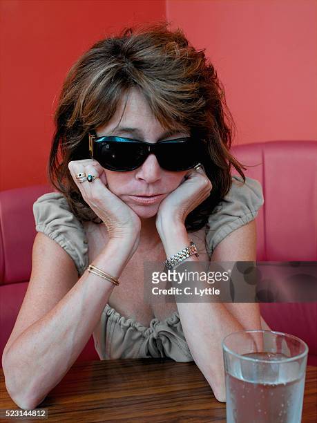 mature woman with hangover - hangover stock pictures, royalty-free photos & images