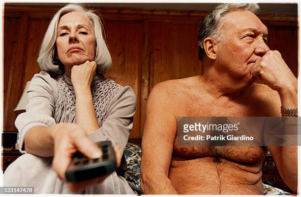 older couple bored of watching television - senior couple funny imagens e fotografias de stock