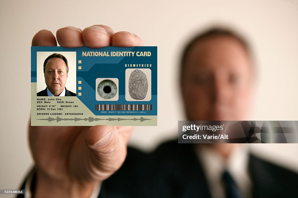 Man Holding Identity Card