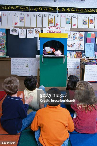 students watching puppet show in class - puppet show stock pictures, royalty-free photos & images