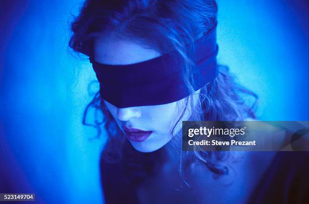 woman blindfolded - blinddoek stockfoto's en -beelden