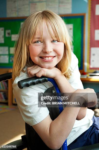 handicapped blond ten year old boy in a wheelchair - paraplegic stock pictures, royalty-free photos & images