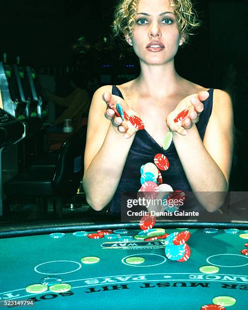 woman spilling poker chips - casino tokens checks or chips stock pictures, royalty-free photos & images