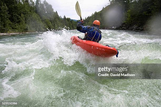 man kayaking in river - river rafting stock pictures, royalty-free photos & images