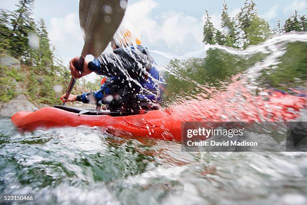 man kayaking in river - recreational boat stock pictures, royalty-free photos & images