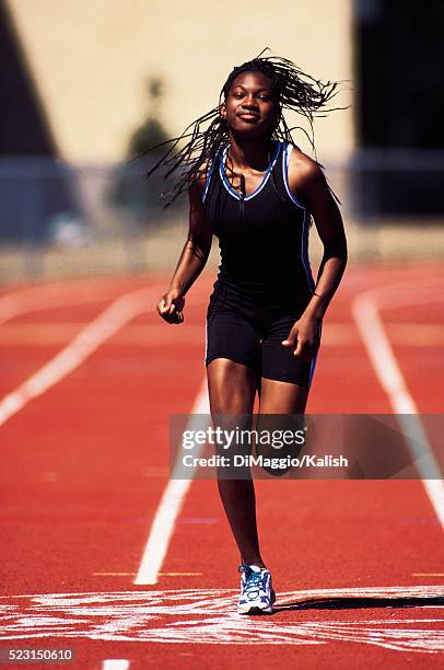 woman running track - track and field vintage stock pictures, royalty-free photos & images