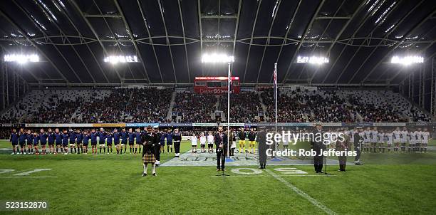 The Highlanders and Sharks stand for a moments silence in remembrance of ANZAC Day during the round nine Super Rugby match between the Highlanders...