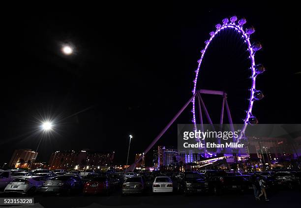 The High Roller at The LINQ Promenade on the Las Vegas Strip is lit with purple lights in memory of recording artist Prince on April 21, 2016 in Las...