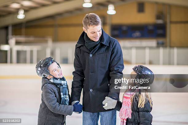 skating indoors on father's day - ice skate indoor stock pictures, royalty-free photos & images