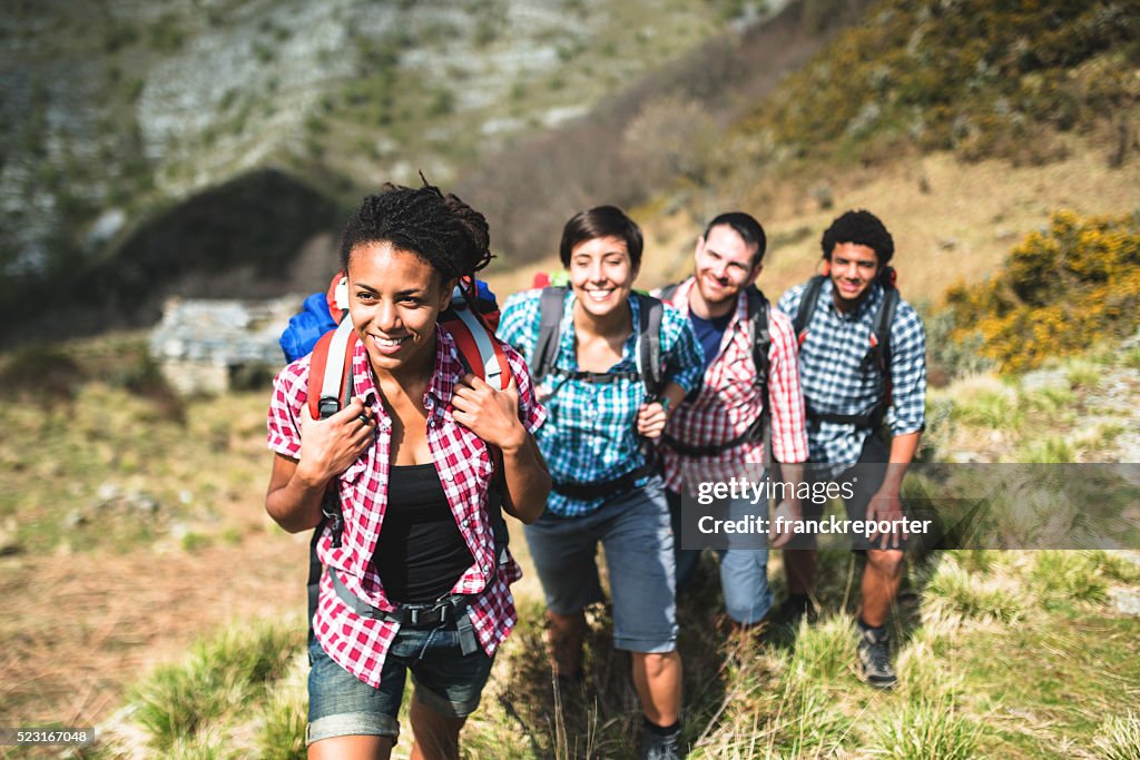 Group of people hiking the mountain togetherness