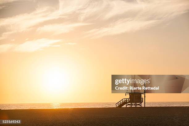 lifeguard tower in sunset - lifeguard tower stock pictures, royalty-free photos & images