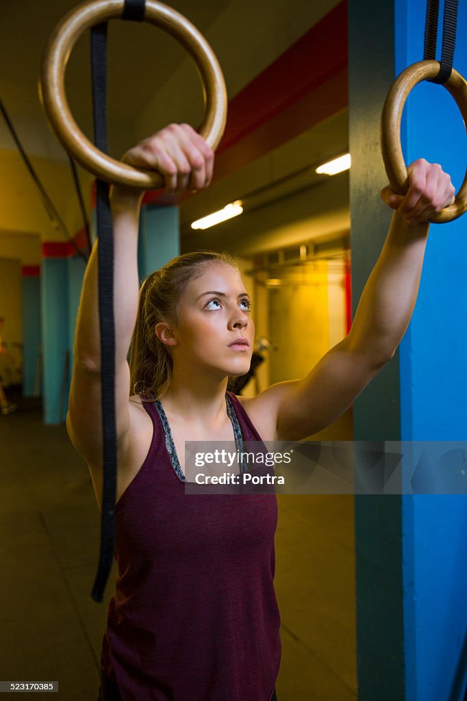 Woman holding gymnastic rings