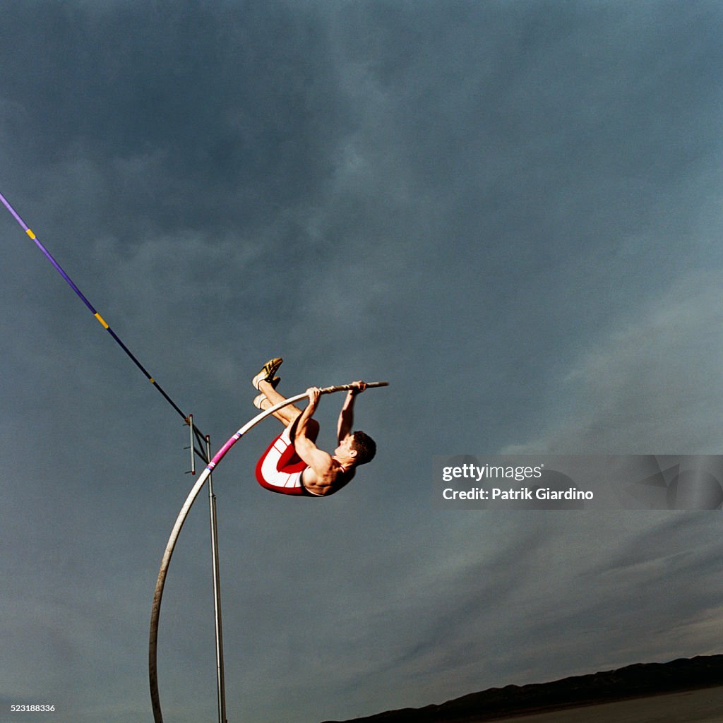 Man Pole Vaulting