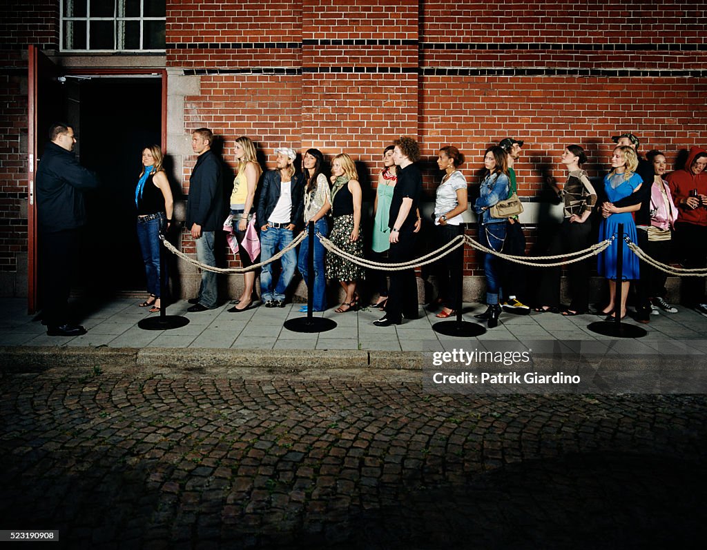 People Waiting in Line Outside Club