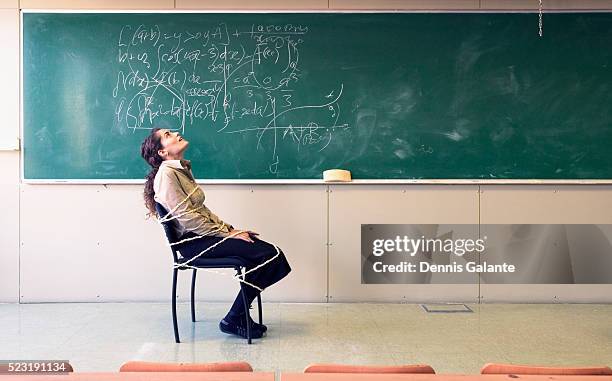 woman struggling with equation - restraining stock-fotos und bilder