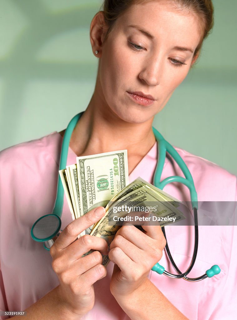 Private doctor with US Dollars