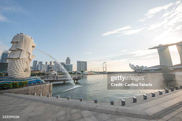 panorama of singapo're iconic landmarks - the merlion, marina bay sands, artscience museum, singapore flyer, float at marina bay - merlion statue stock pictures, royalty-free photos & images