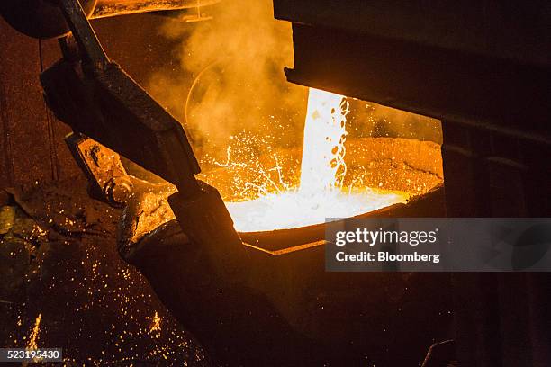 Molten copper flows from a furnace into a ladle at the Aurubis AG metals plant in Hamburg, Germany, on Thursday, April 21, 2016. China has...