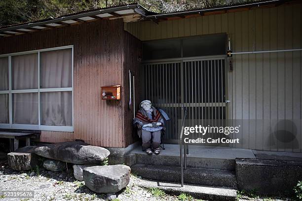 Hand-made doll sits outside an abandoned house as others are placed around the village by local resident Tsukimi Ayano to replace the dwindling local...