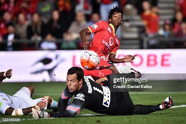 Bruce Kamau of United strikes the ball as Thomas Sorensen of Melbourne City attempts a save during the A-League Semi Final match between Adelaide...
